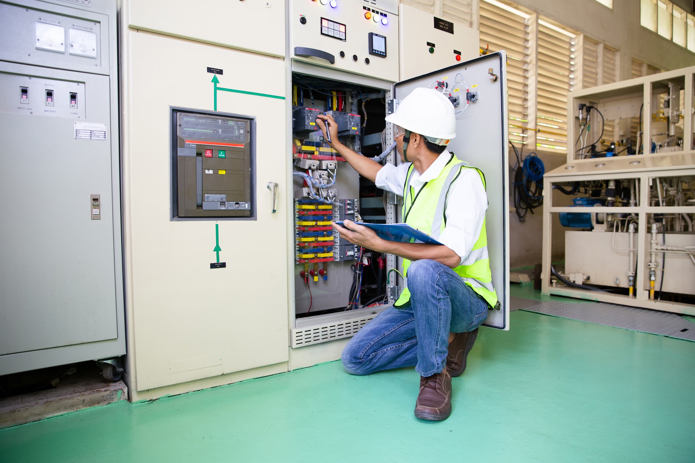 Electrical Engineer Checking the Switchgear